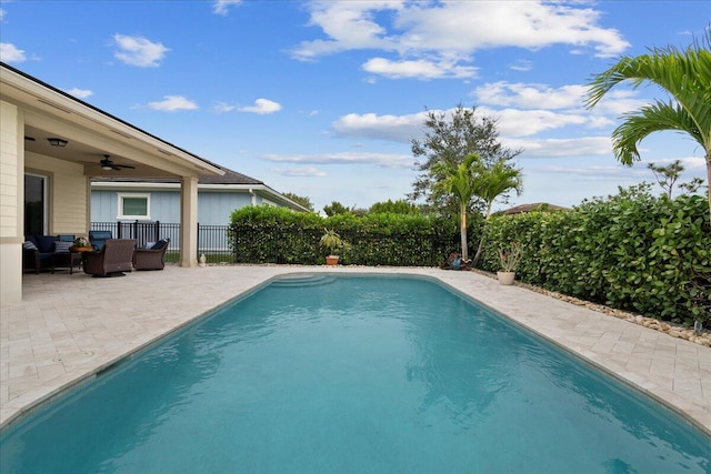 view of pool featuring a patio area and ceiling fan