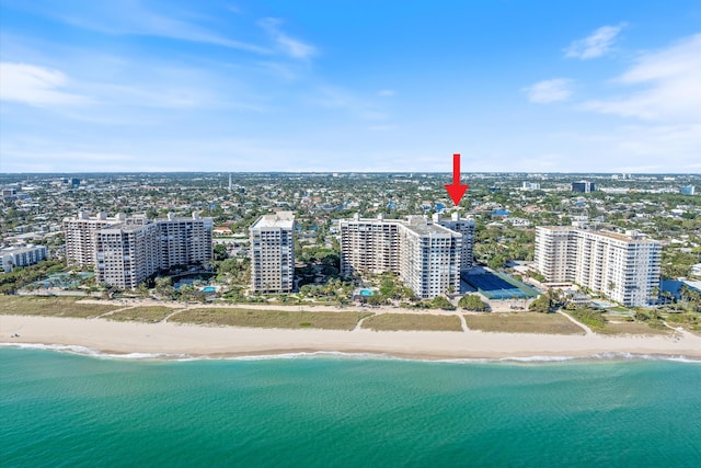 bird's eye view featuring a water view and a view of the beach