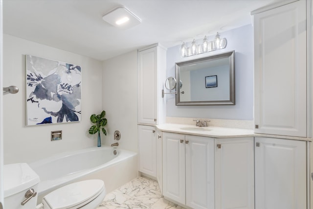 bathroom with toilet, vanity, and a bathing tub