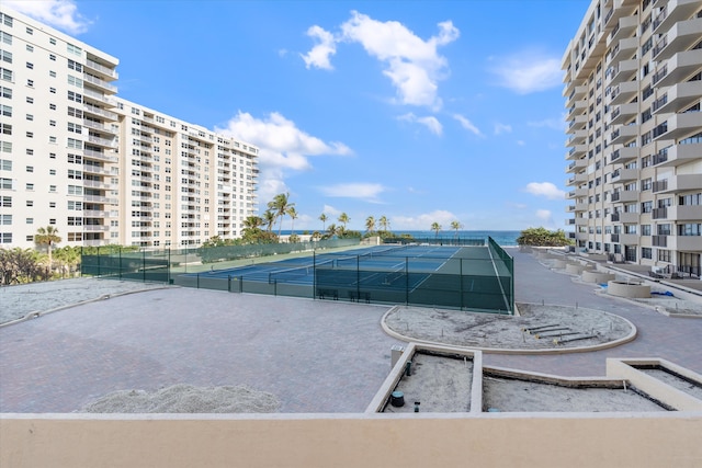 view of swimming pool featuring tennis court