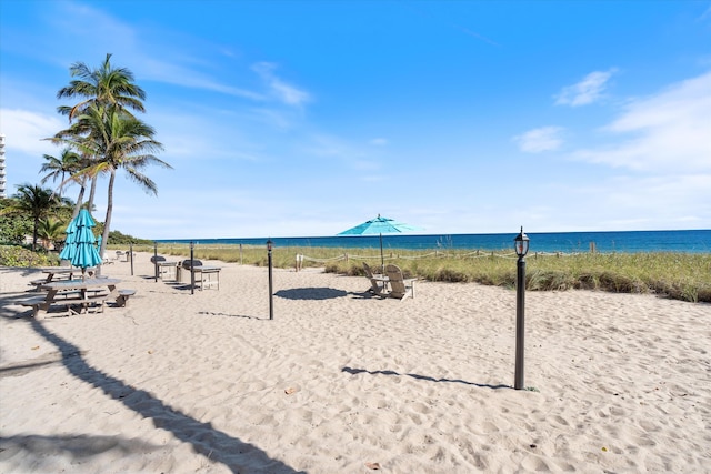 property view of water featuring a beach view