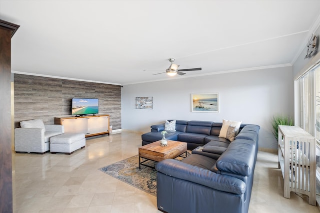 living room with ceiling fan and ornamental molding