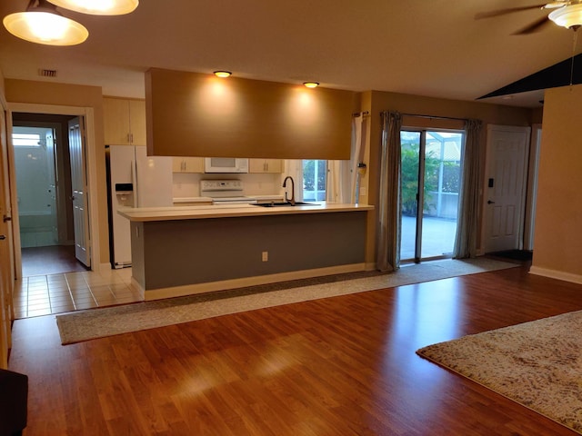 kitchen with sink, white appliances, ceiling fan, kitchen peninsula, and light wood-type flooring