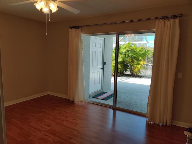 empty room featuring ceiling fan and hardwood / wood-style floors