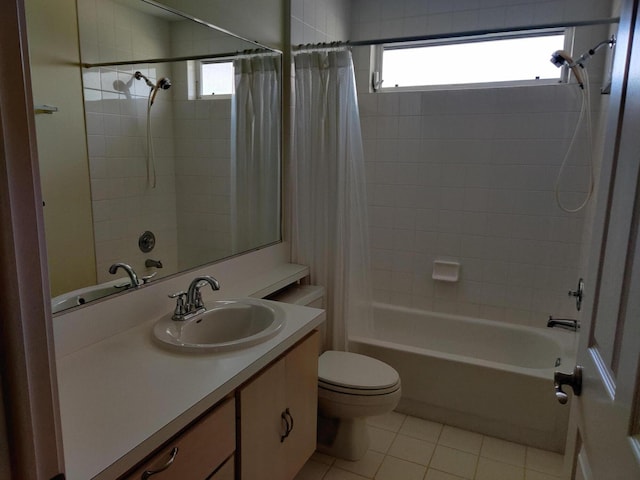 full bathroom featuring tile patterned flooring, a wealth of natural light, toilet, and shower / bath combo with shower curtain