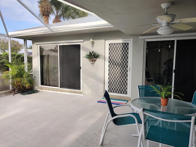 view of patio / terrace with a lanai and ceiling fan