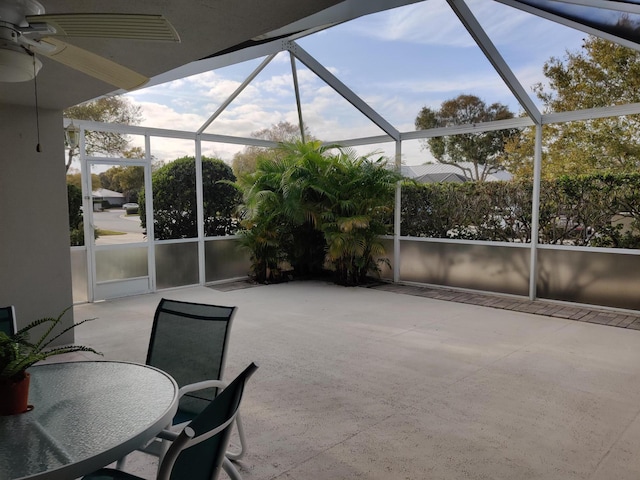 view of patio with a lanai