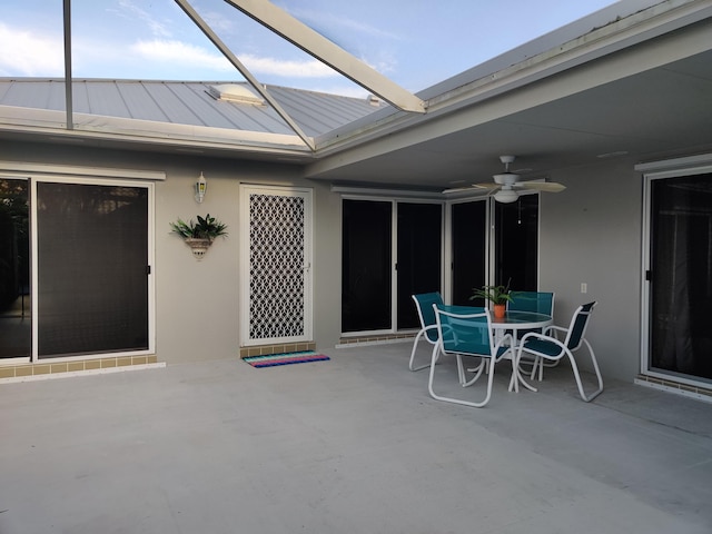 view of patio featuring ceiling fan