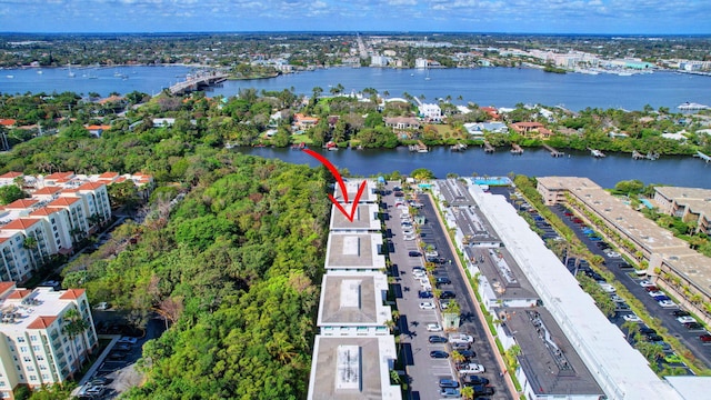 birds eye view of property with a water view