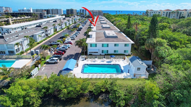 birds eye view of property with a water view