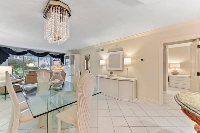 tiled dining room with crown molding and an inviting chandelier