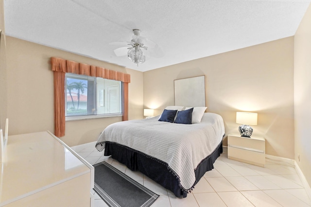 bedroom with light tile patterned floors and ceiling fan