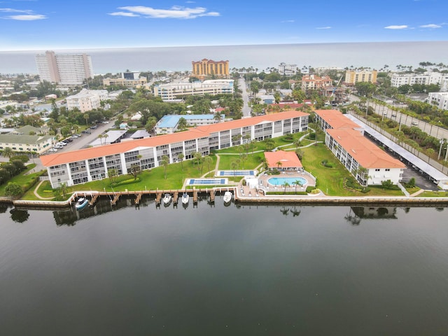 birds eye view of property with a water view