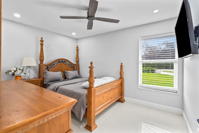 tiled bedroom with ceiling fan