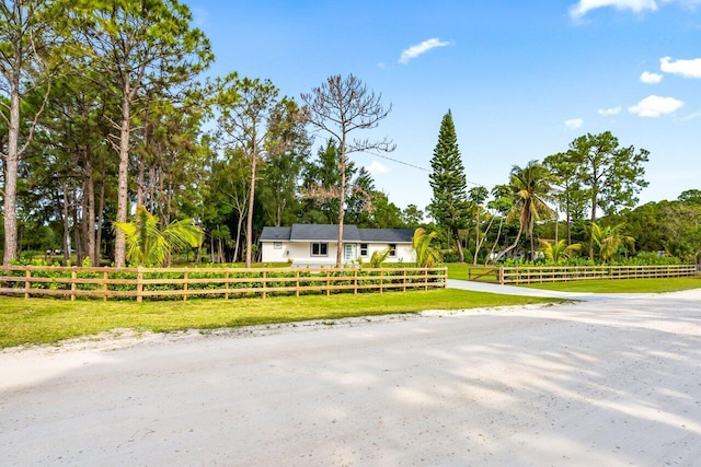 single story home featuring a front yard