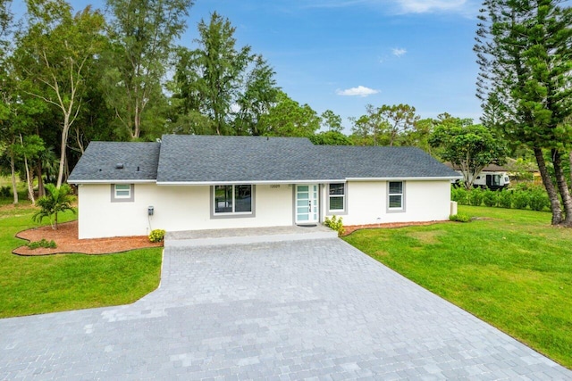 ranch-style home with a front lawn