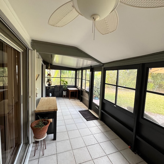 sunroom featuring vaulted ceiling