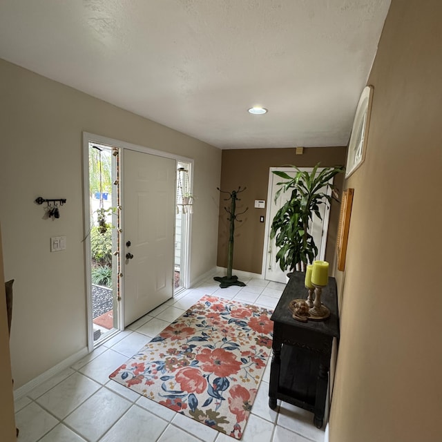 entryway with light tile patterned floors