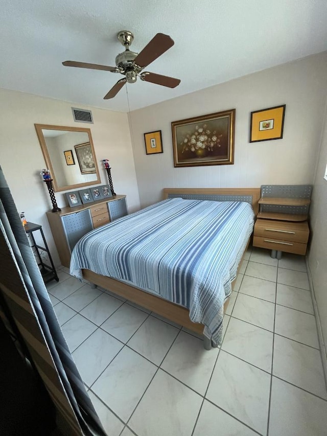 bedroom featuring ceiling fan and light tile patterned floors