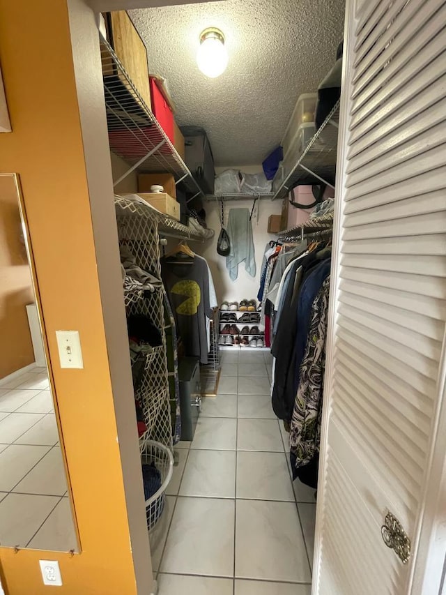 spacious closet with tile patterned flooring