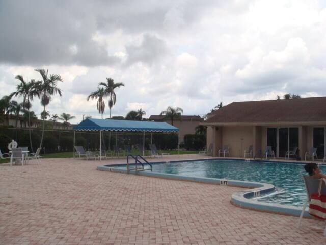 view of swimming pool with a patio area