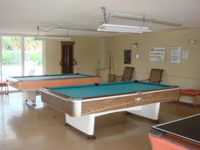 rec room with a textured ceiling and billiards