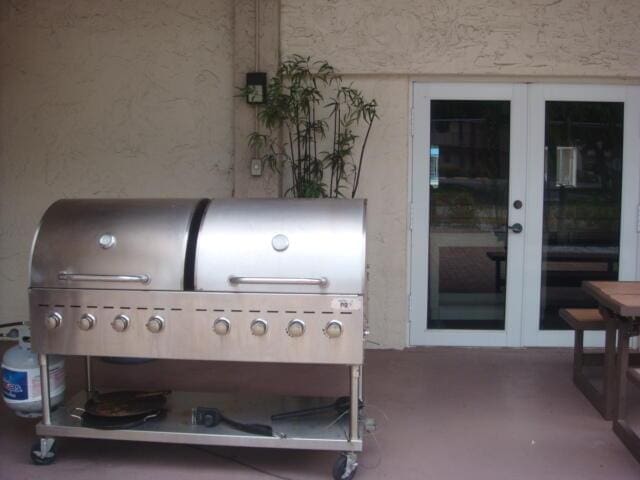 exterior space featuring french doors and area for grilling