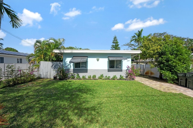 ranch-style house with a front yard