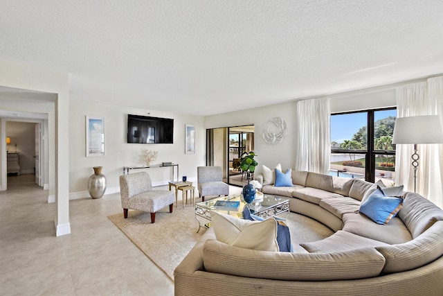 living room featuring a textured ceiling