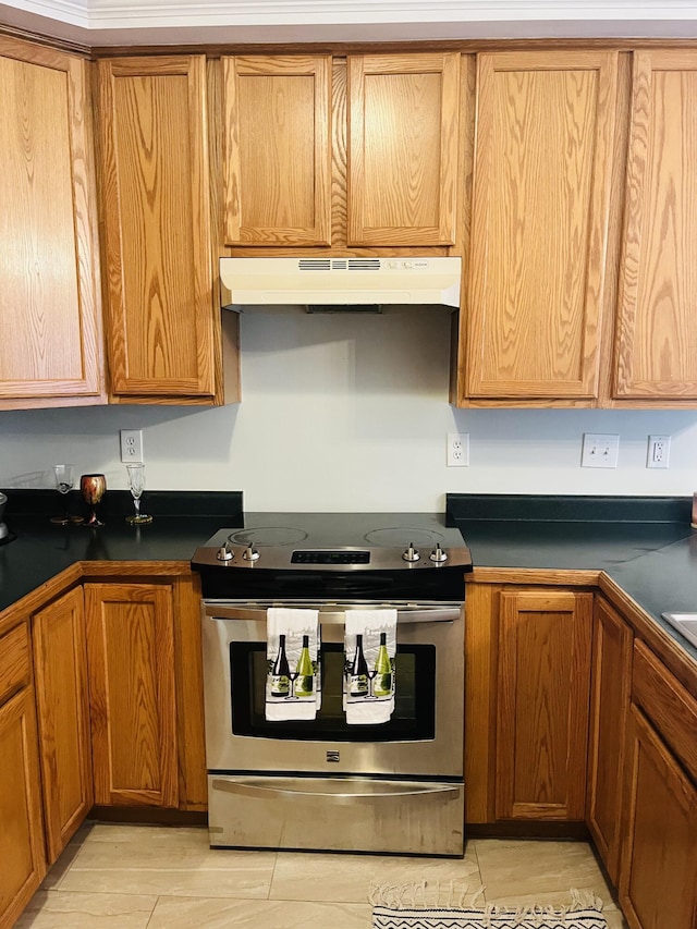 kitchen featuring electric stove and light hardwood / wood-style floors