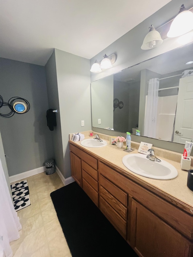 bathroom featuring a shower with curtain and vanity