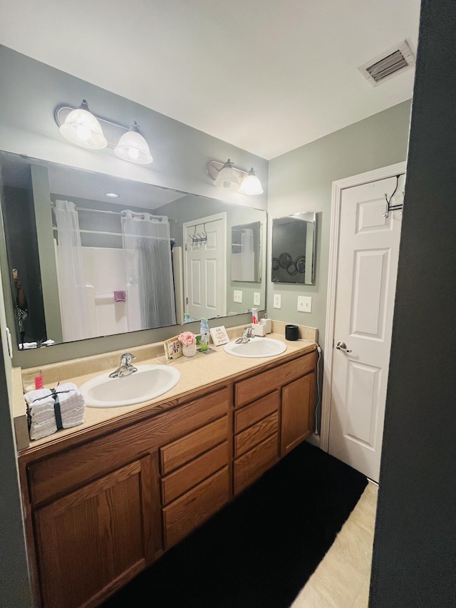 bathroom with vanity and a shower with shower curtain