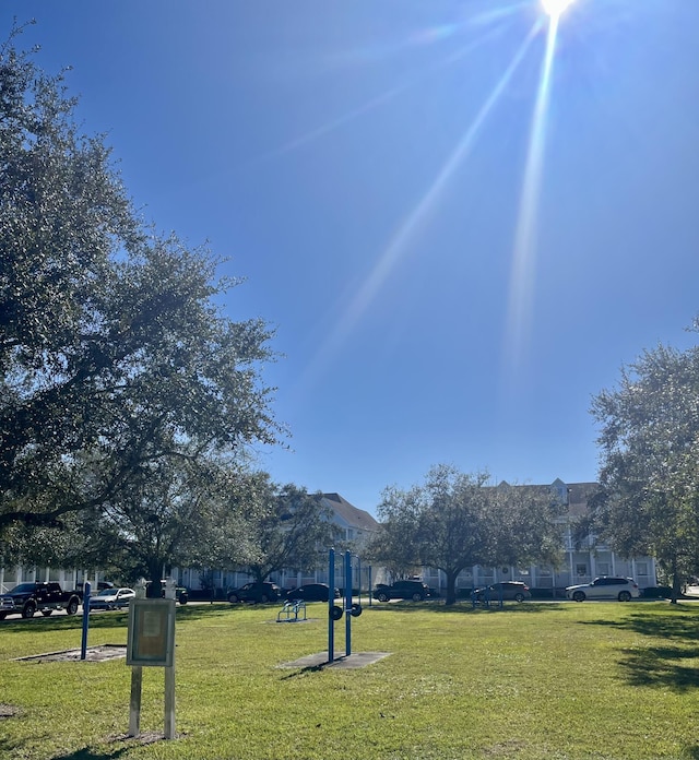 view of property's community with a lawn