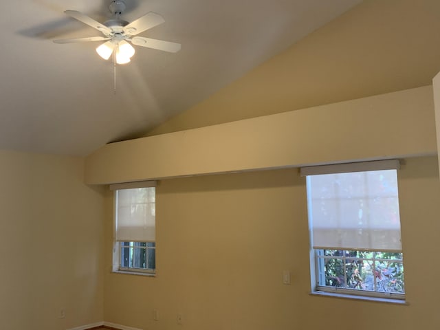 interior space with lofted ceiling and ceiling fan