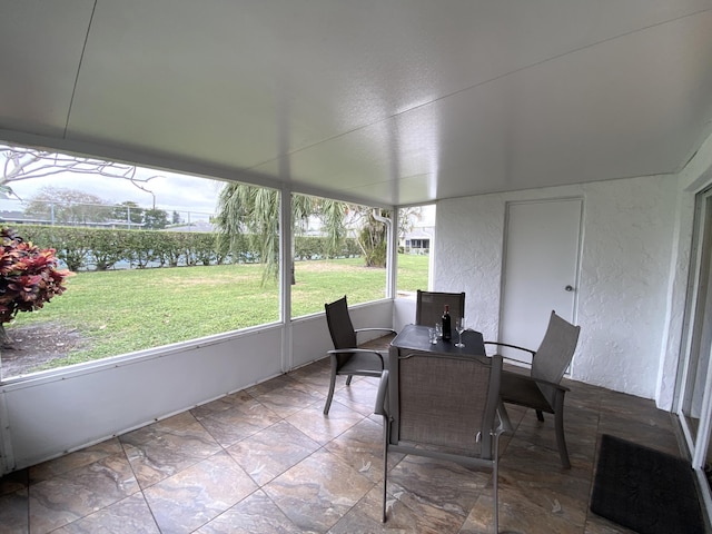 sunroom with a water view