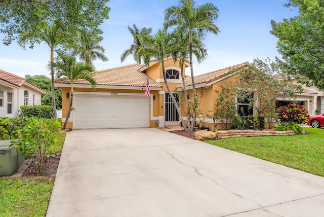 mediterranean / spanish-style home with a front yard and a garage