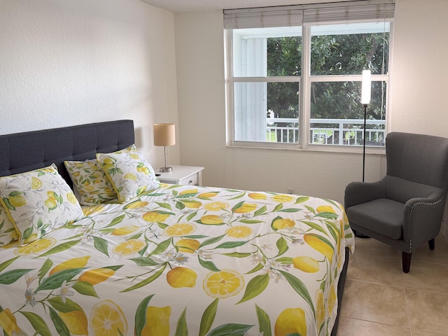 bedroom with light tile patterned floors