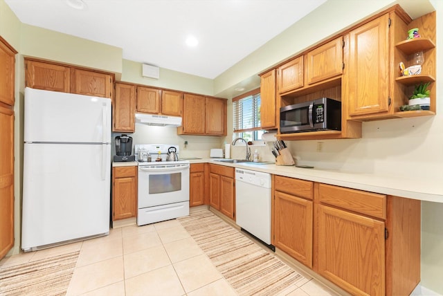 kitchen with sink, white appliances, and light tile patterned floors