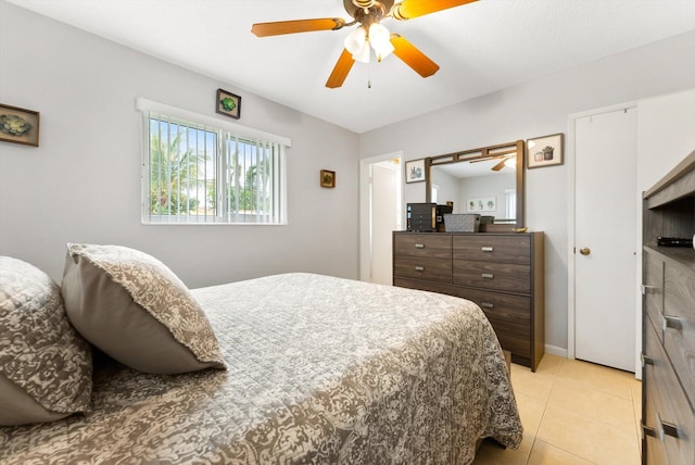 tiled bedroom with ceiling fan