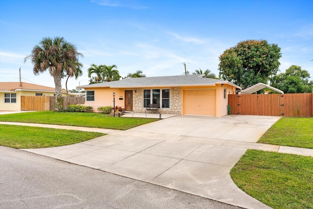 ranch-style home with a front yard and a garage