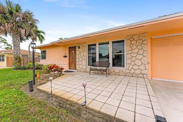 exterior space with a lawn and a patio area