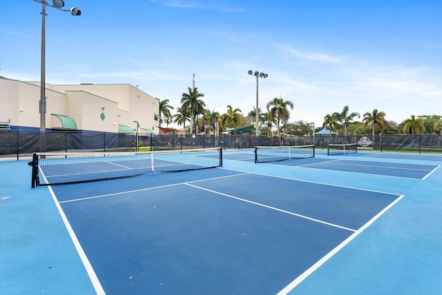 view of tennis court featuring basketball court