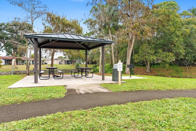 surrounding community featuring a gazebo and a yard