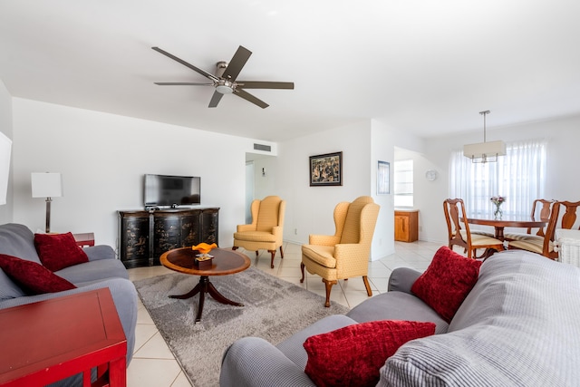 tiled living room with ceiling fan