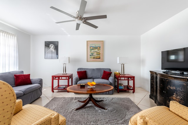 living room with ceiling fan and light tile patterned flooring