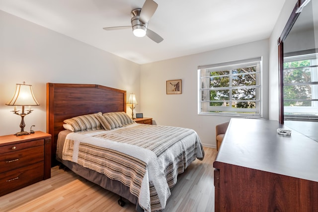 bedroom with ceiling fan and light hardwood / wood-style flooring