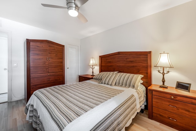 bedroom with ceiling fan and light wood-type flooring