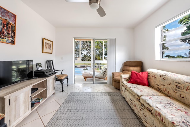 living room with light tile patterned floors and ceiling fan