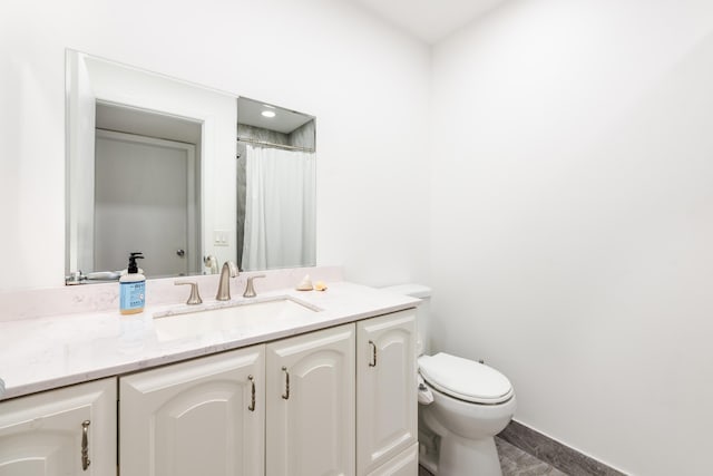 bathroom with vanity and toilet