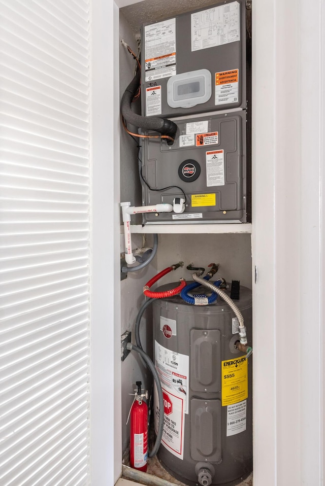 utility room featuring electric water heater